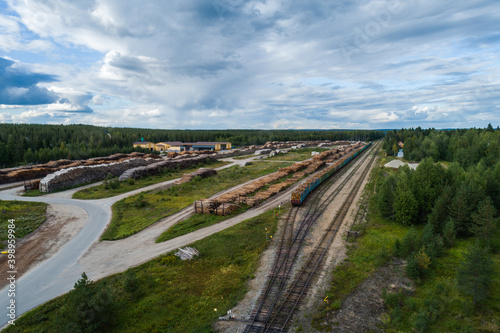 Hyrynsalmi railway yard with log wood waiting for railway transport to saw mills, Finland
