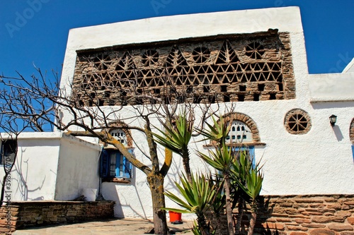 Traditional houses decorated like dovecotes at the village of Tarambados in Tinos island, Greece.