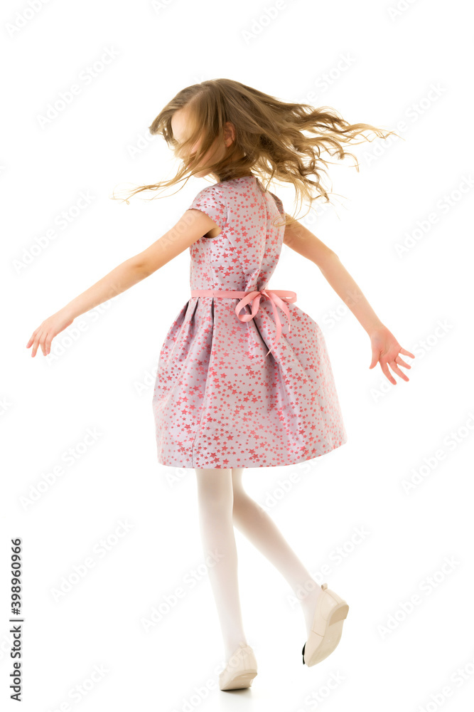 Naklejka premium Happy Girl with Long Hair Wearing Pink Dress Having Fun