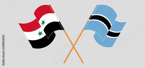 Crossed and waving flags of Syria and Botswana