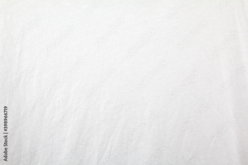 White blank crumpled cotton textile background. Closeup white fabric texture.