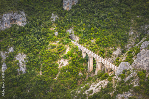 The old railway bridge of the Asopos river near village Iraklia at national park of Oiti, Greece photo