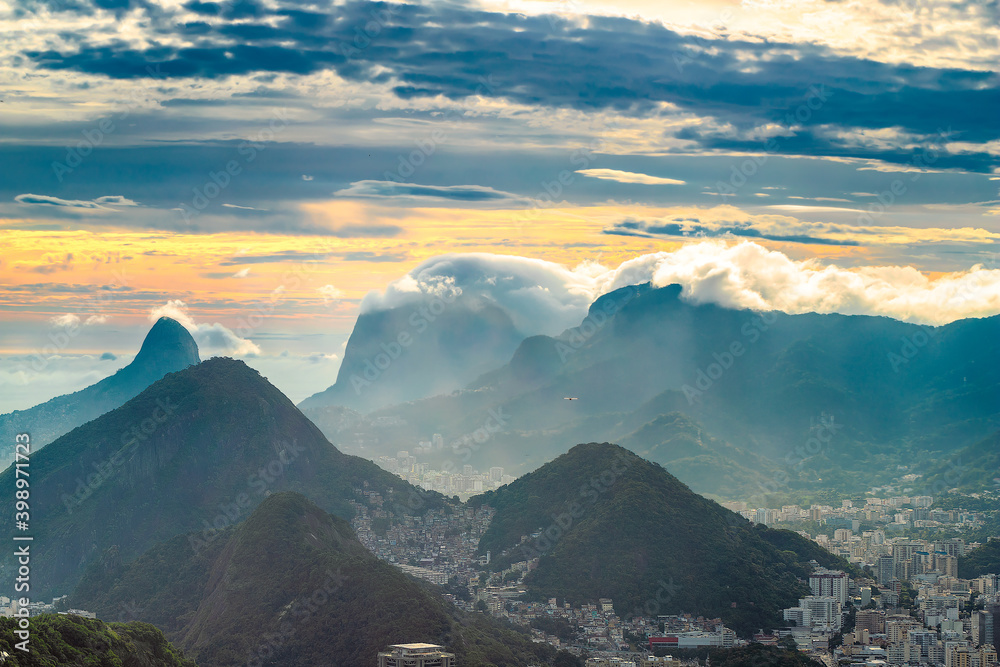 Looking out from Mount Urca over Rio de Janeiro as rain rolls in over the distant mountains.