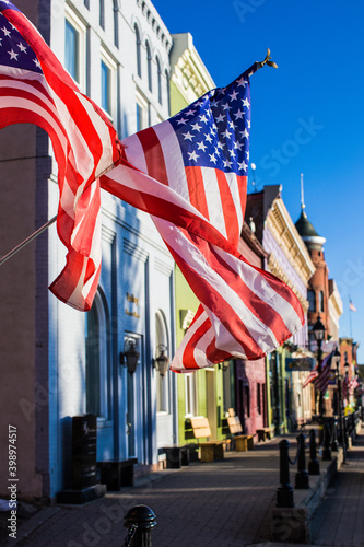 Vászonkép The American flag, stars and stripes, flying in the wind in Leadville, Colorado