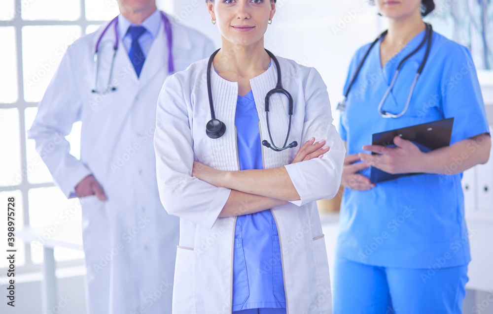 Group of doctors and nurses standing in the hospital room Group of doctors and nurses standing in the hospital room