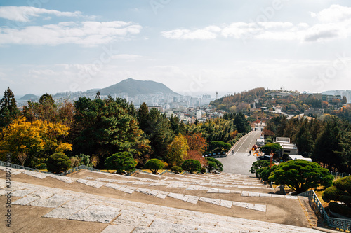 Autumn scenery of Democracy Park and Busan cityscape from Jungang Park (Daecheong Park) in Busan, Korea photo