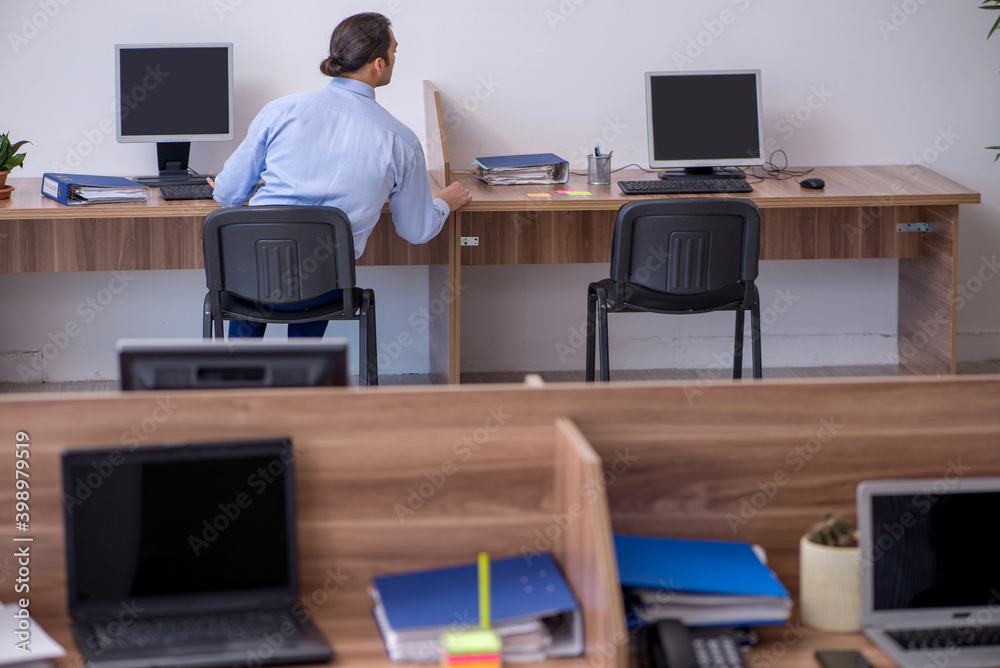 Young male employee in industrial espionage concept Young male employee in industrial espionage concept