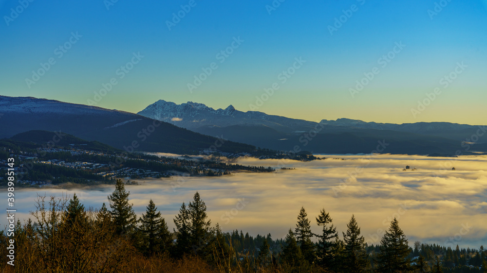 sunrise in the mountains and cloud inversion on valley floor