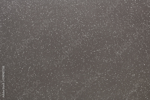Closeup of a grilling ceramic non-stick plate spotted with white dots.