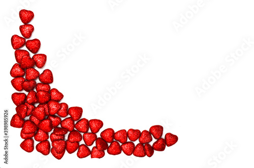holiday background of red decorations in the form of hearts top view for copy space text or design