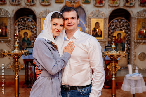 beautiful married couple in the church. Christian family religious traditions. 