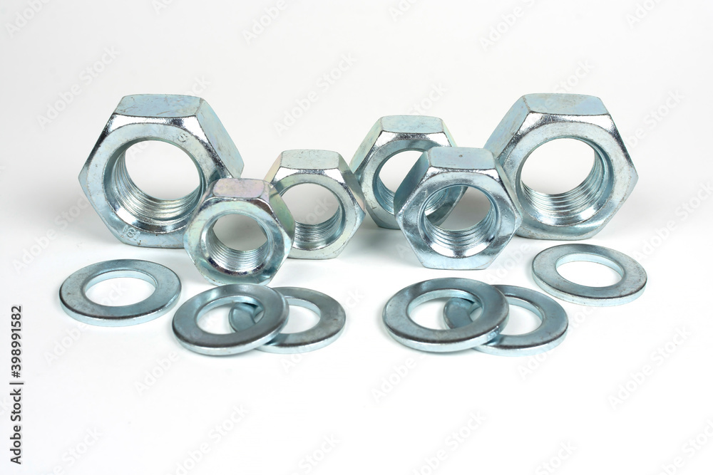 metal nuts and washers on a white background metal nuts and washers on a white background