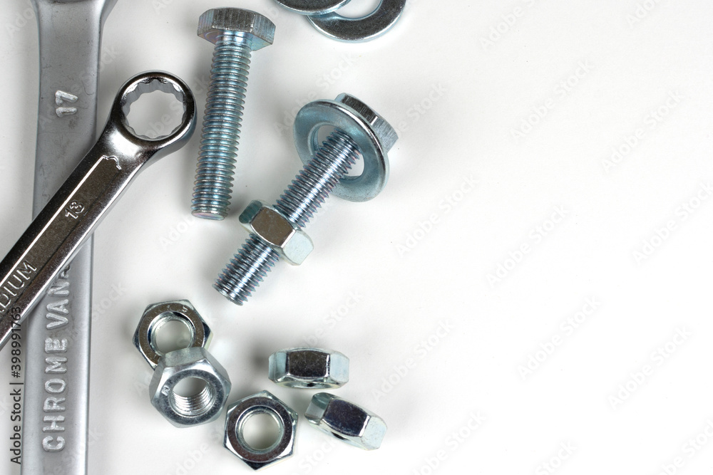 wrenches and bolts with metal nuts close up