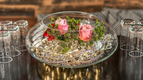 Pink rose flowers in a glass bowl with led lights