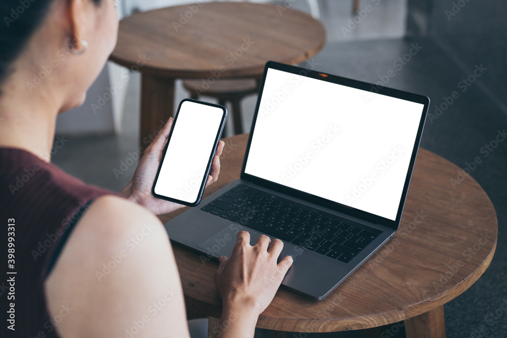 computer screen,cell phone blank mockup.hand woman work using laptop ...