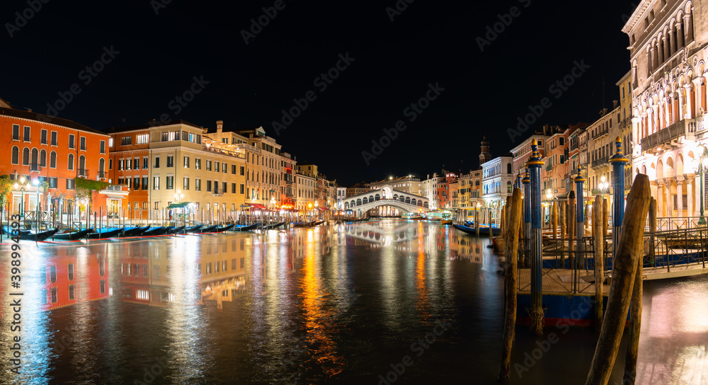 Grand Canal and Rialto bridge at night in Venice, Italy