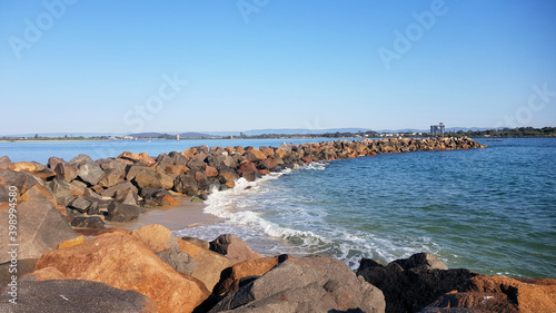 The Breakwater at Swansea Heads New South Wales Australia. Made of rocks and boulders with a walkway on top © Diane
