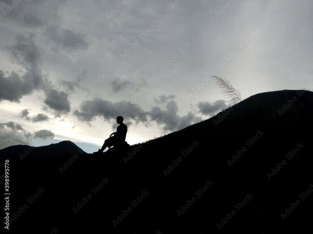 silhouette of a person at Guntur Mountain