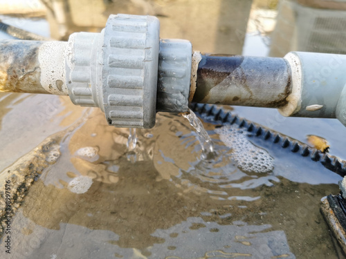 Canvas Print humid leaking pipe of a central air conditioning system and cold water drops on
