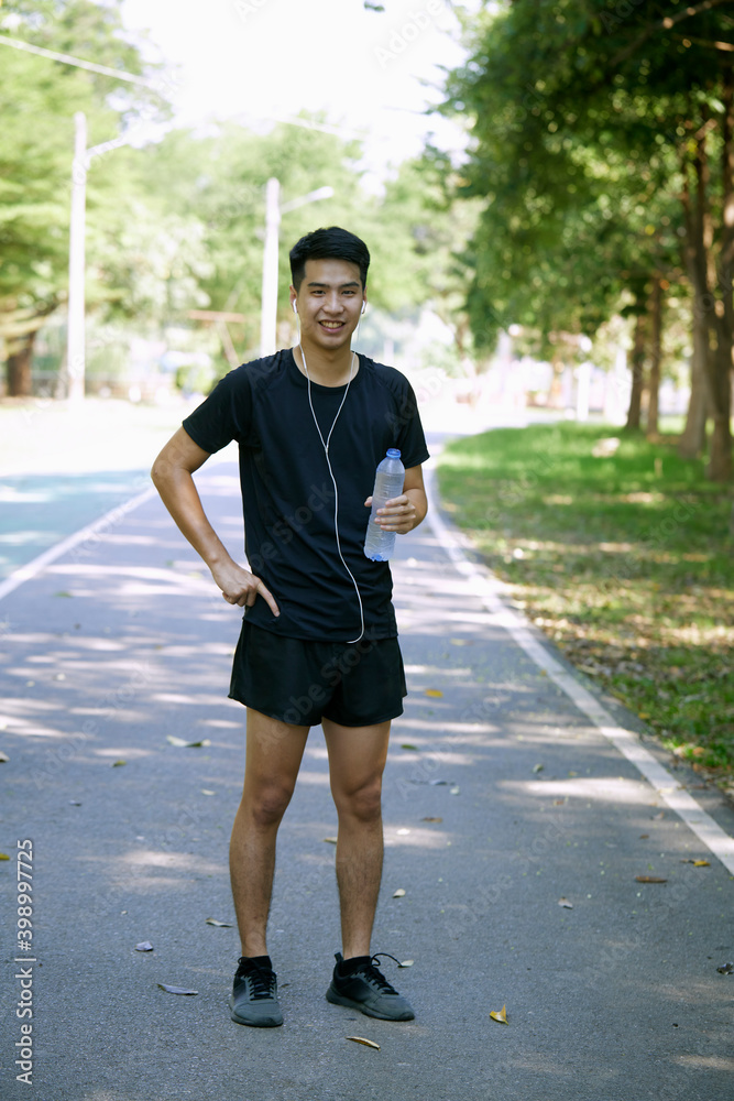 A man standing for a break from exercise A man standing for a break from exercise