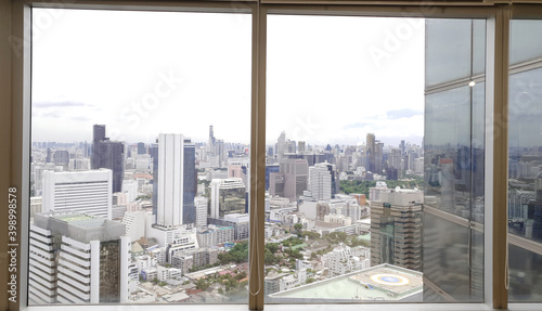 Office building window interior deign with modern city skyline background, Beautiful real estate building and skyscrapers in Bangkok Thailand