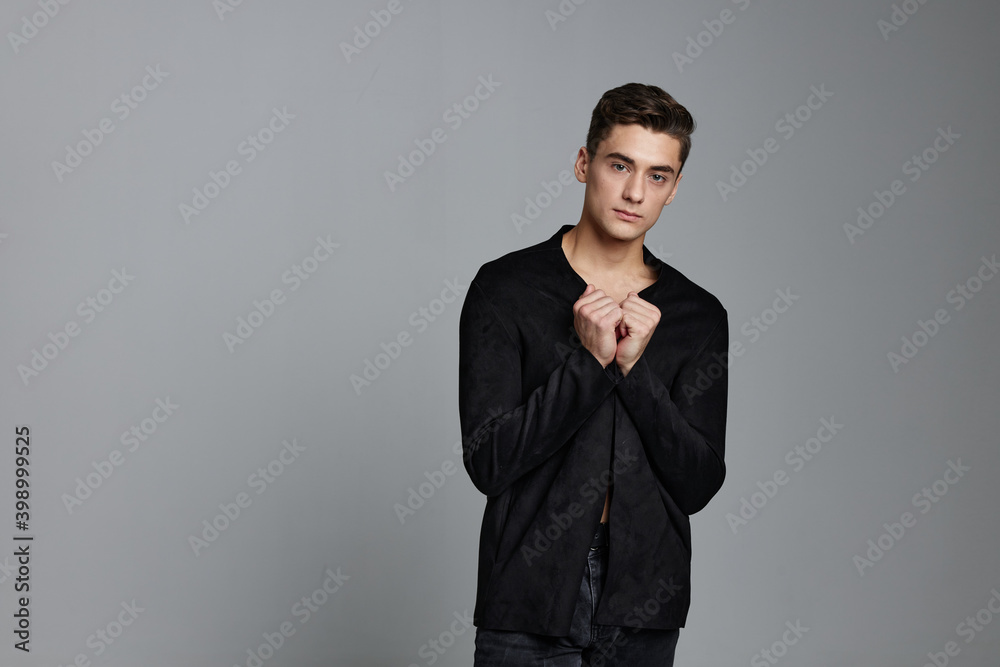 elegant gentleman in dark suit gesturing with hands on gray background cropped view elegant gentleman in dark suit gesturing with hands on gray background cropped view
