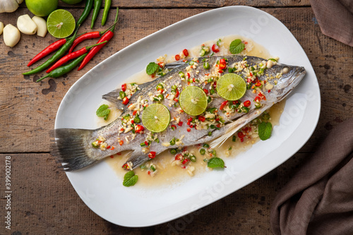 Photography Steamed Seabass with Spicy Chili and Lemon Sauce.Top view