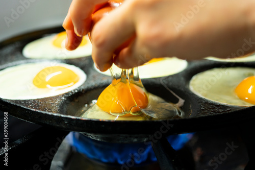 Cooking eggs with a multiple egg pan