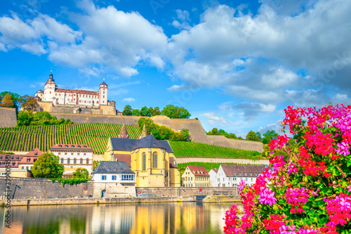 Saint Burkard Catholic Church and Marienberg Fortress at river Main in Wurzburg. Germany photo