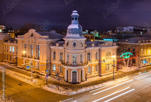 The old building of the Russian-Asian bank in the historical center of irkutsk city at night photo