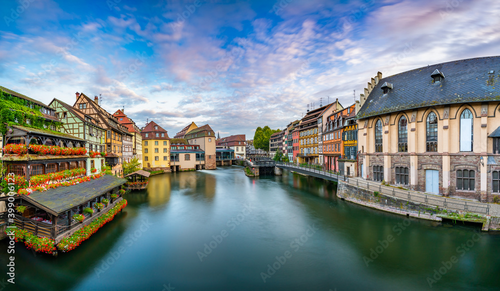 Old town architecture of Strasbourg, Alsace, France. Traditional half timbered houses near water canal of Petite France