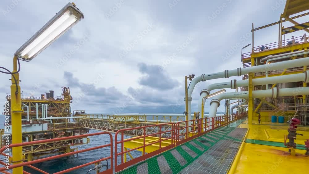 4K time lapse of yellow processing platform of oil and gas in the middle of South China sea with blue sky and thick clouds movement. 4K time lapse of yellow processing platform of oil and gas in the middle of South China sea with blue sky and thick clouds movement.