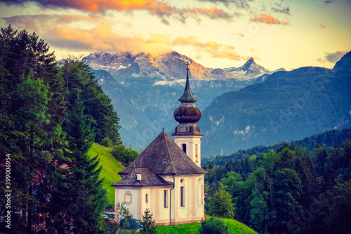 Maria Gern church at sunset with famous Watzmann summit in the background. Berchtesgadener Land in Bavaria, Germany