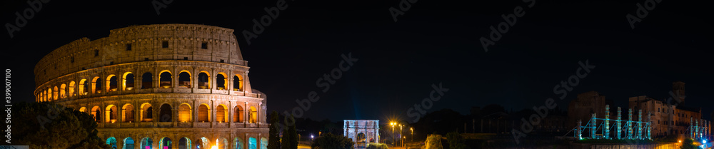 Night time panorama of Colosseum and Temple of Venus and Rome 
