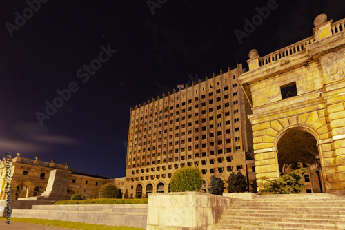 Destroyed government building against the background of a clear night sky