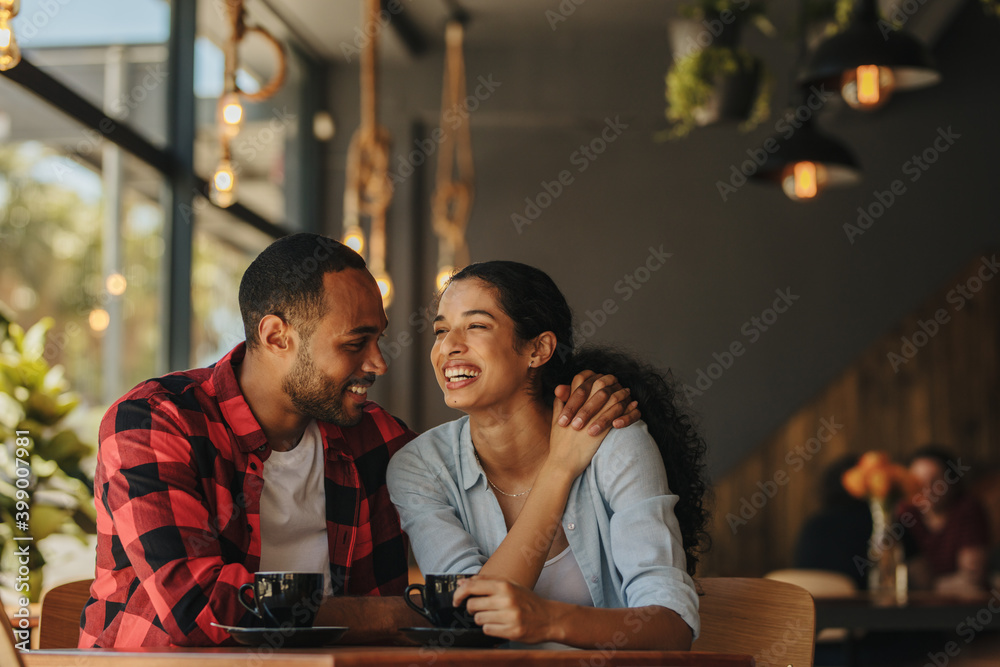 Loving couple having a conversation at coffee shop Loving couple having a conversation at coffee shop