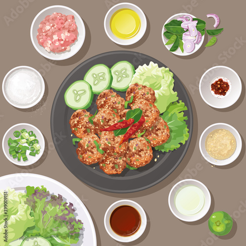 Top view of Thai food, fried spicy minced pork salad with ingredients. (Larb Moo Thod).