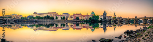 Photo Sunrise panorama of Prague including Old town tower and Charles and Manes bridge