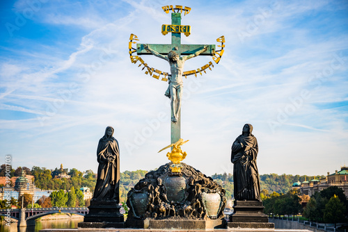 Charles Bridge crucifixion statue at Charles bridge in Prague. Czech Republic
