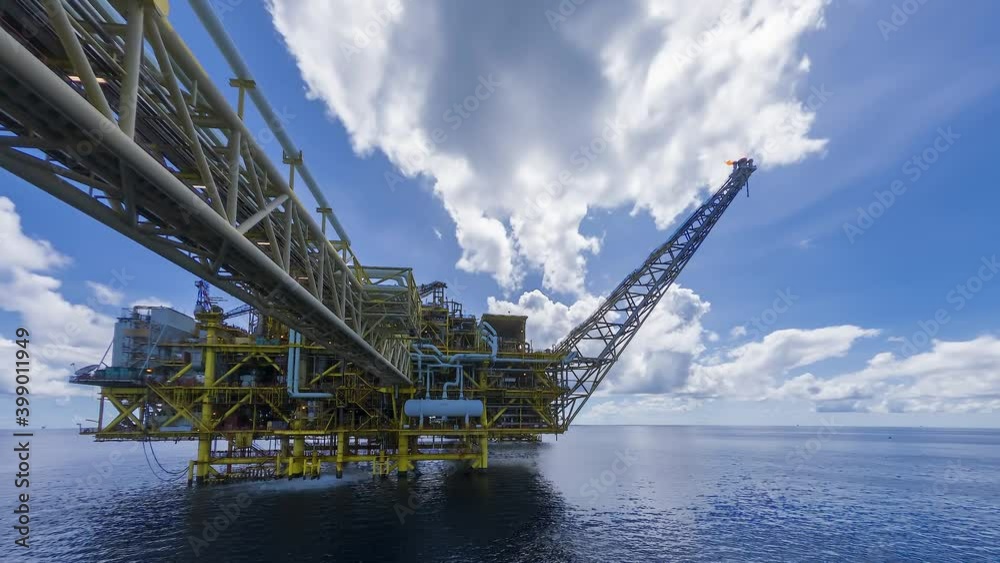 4K time lapse of yellow centre processing platform of oil and gas in the middle of South China sea with blue sky and thick clouds movement. 4K time lapse of yellow centre processing platform of oil and gas in the middle of South China sea with blue sky and thick clouds movement.