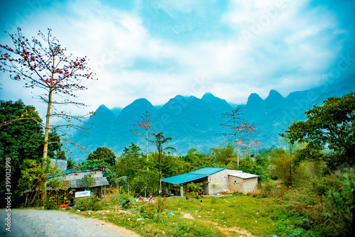  road in the mountains with blue sky on the background at Ha Giang province, Viet Nam photo