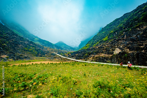  road in the mountains with blue sky on the background at Ha Giang province, Viet Nam photo