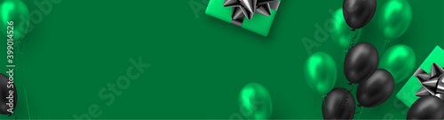 Glossy balloons in green and black colors with gift box. Vector balloons background for holidays or birthday party. Copy space, green background.