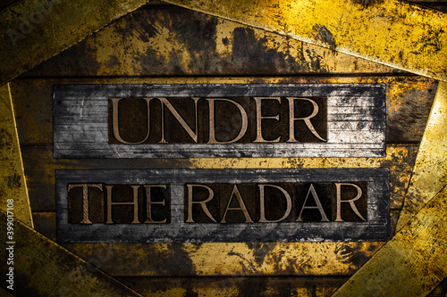 Under The Radar text on vintage textured bronze grunge copper and gold background