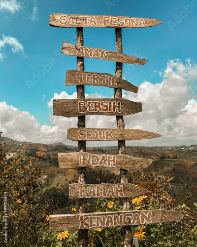 wooden signpost in the mountains