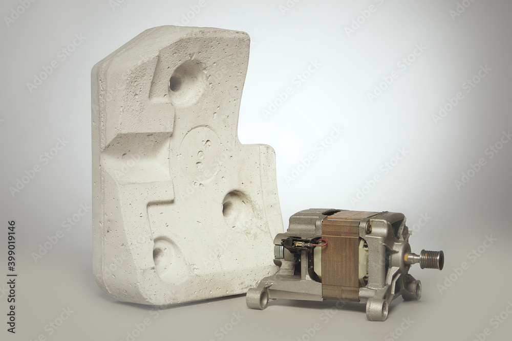 Unmounted washing machine engine with concrete weight block Unmounted washing machine engine with concrete weight block