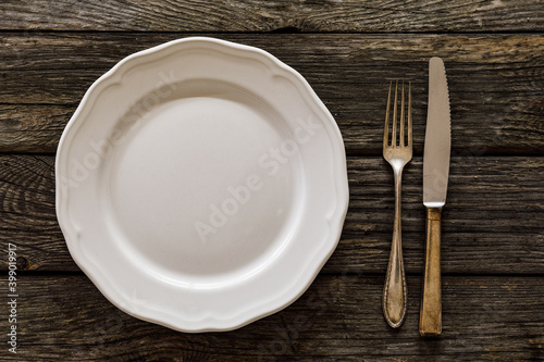 Empty plate on wooden table 