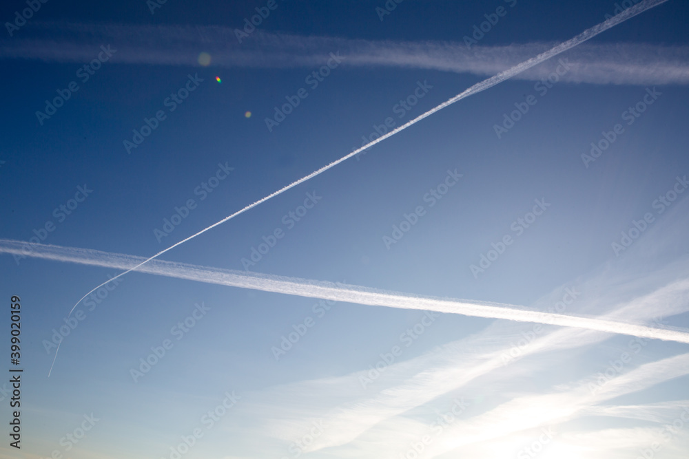 A few white lines from planes in the sky A few white lines from planes in the sky