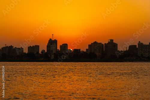 Sunset on the skyline of the city of Cairo, the sun goes down on the buildings of the city of Cairo in the background. Africa © unai
