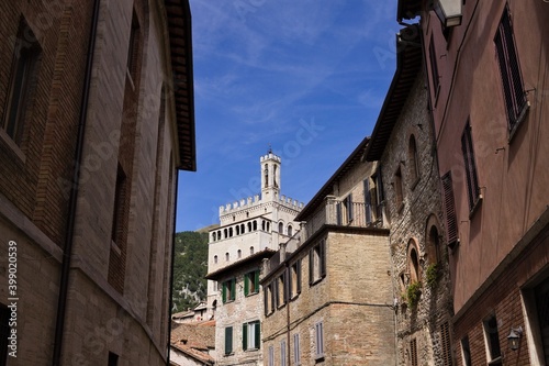 The "Palazzo dei Consoli" (Consuls Palace) with its bell tower overlooks the city of Gubbio, an Italian medieval village (Umbria, Italy, Europe)